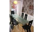 glass extendable dining room table and six chairs. Glass....