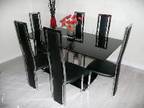 DESIGNER BLACK GLASS DINING TABLE. 160 x 90cms. Set on....