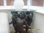 Glass Table with Cherubs Cherubs Are of a Dark Brown, ....